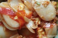 The method of stir frying tomato rice cake