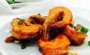 The method of braising prawns in tomato sauce