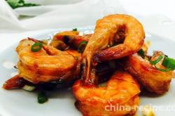 The method of braising prawns in tomato sauce