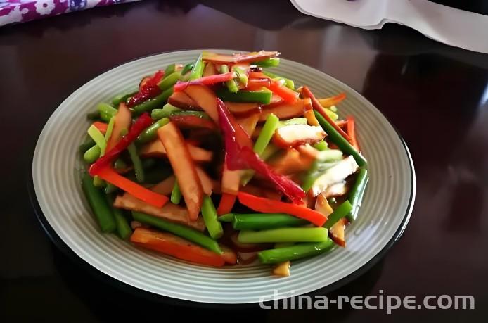 Stir fried dried tofu with garlic sprouts