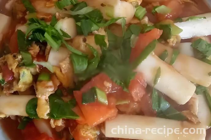 The recipe for stir fried rice cake with tomatoes and eggs